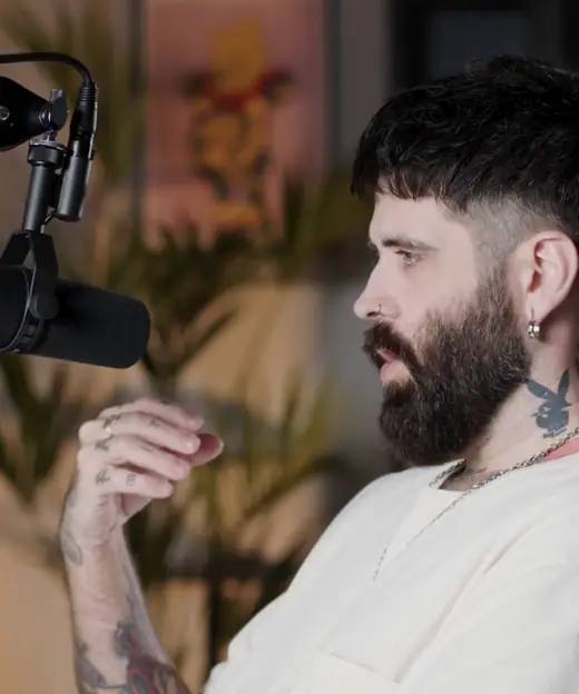 Coreh speaking into a microphone.