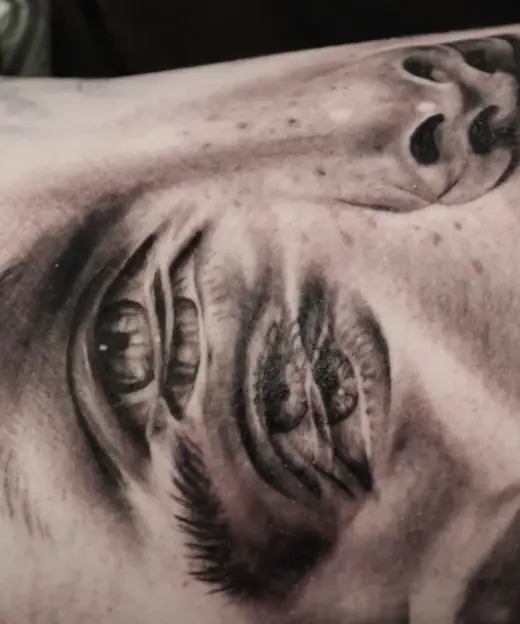 Close-up of a tattooed eye with the double-vision effect.