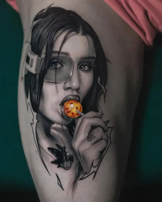 Tattoo of an anime-style woman holding an orange sphere between her lips